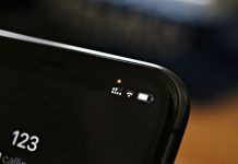 O que é a bolinha verde/amarela na tela do iPhone?